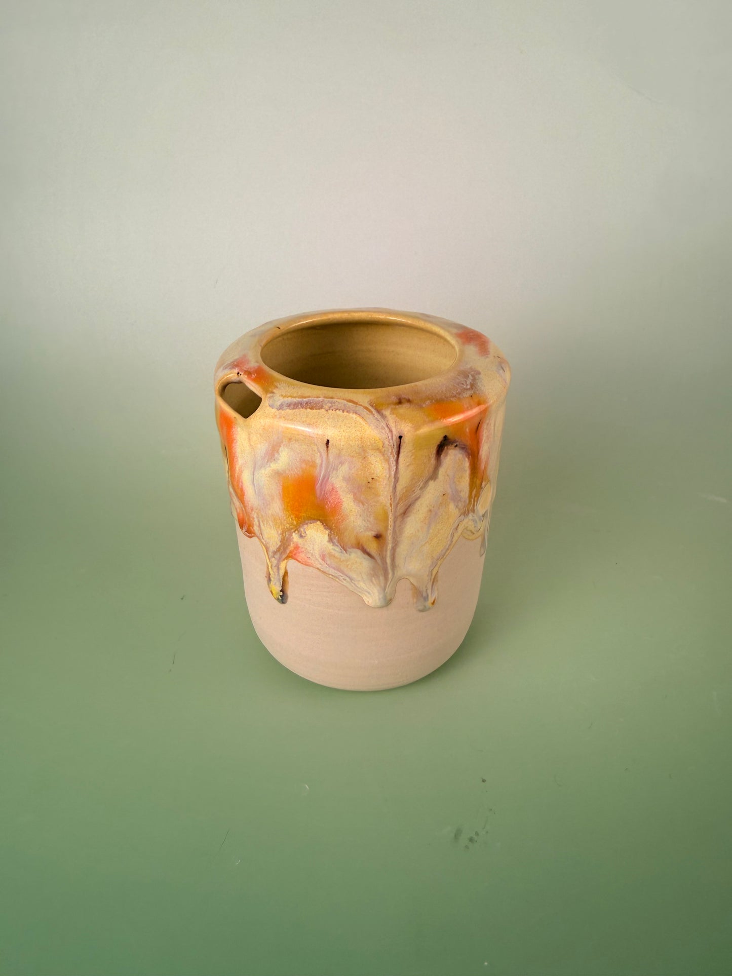 Yellow drippy travel cup