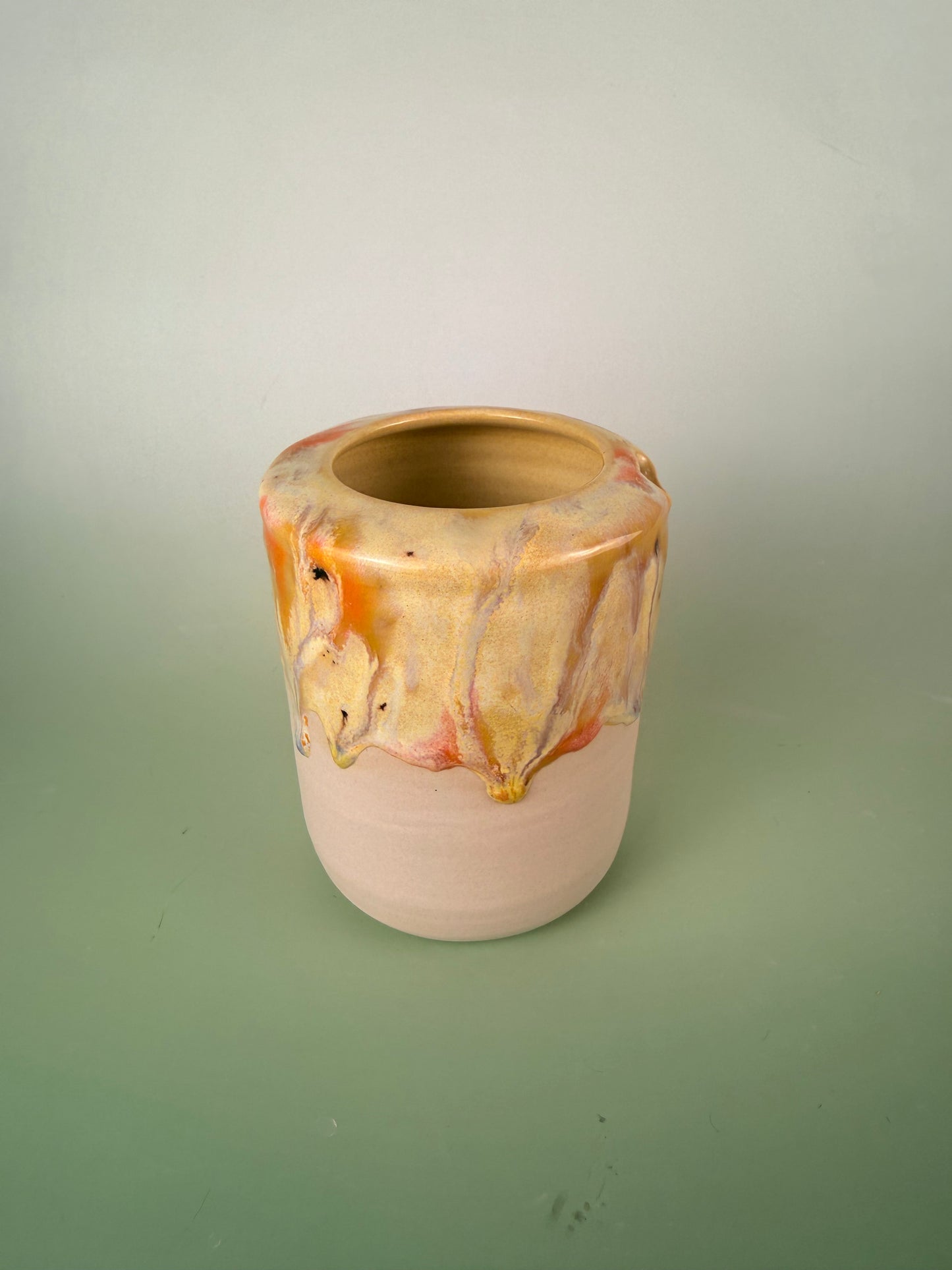 Yellow drippy travel cup