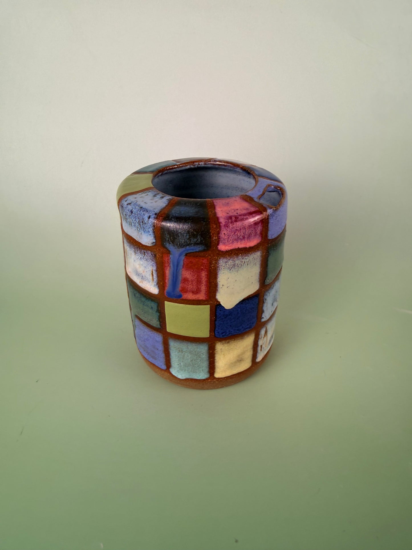 Dark clay checkered cup